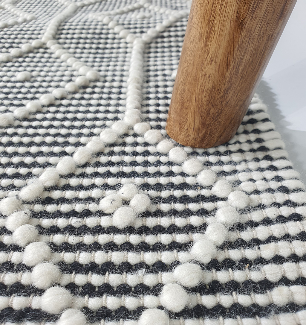 Elegant White & Black Wool and Cotton Decor Woven Rug SR 005 (170x240cm) by Ramsha Home Elegant 170x240cm woven rug in white and black, crafted from wool and cotton, SR 005, ideal for sophisticated home interiors by Ramsha Home.