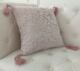 Polyester cushion in pink for sofa or office decor,
