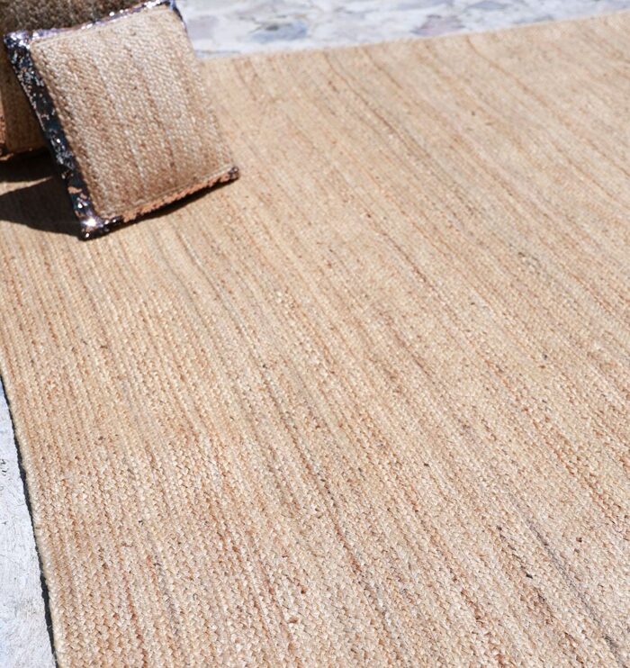 Natural jute rug for indoor and outdoor use, perfect as living room rugs or outdoor rugs in UAE homes.