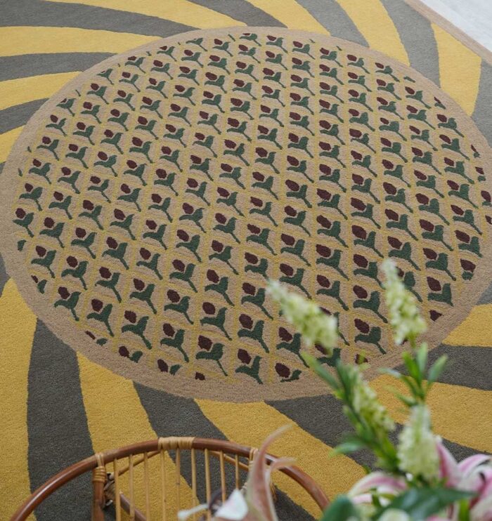Handmade wool rug with intricate design, soft texture, and timeless decorative appeal for home interiors.