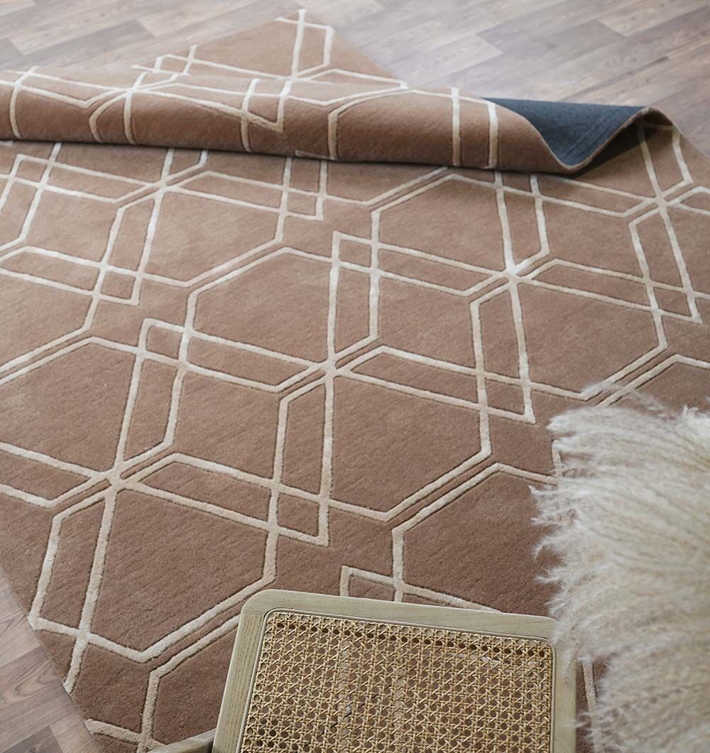 Handmade Silk Rugs & Tufted Carpets – Premium Carpet Store Dubai | Rugs UAE Elegant handmade silk rug in a stylish living room, from a top carpet store in Dubai, offering the finest rugs UAE.