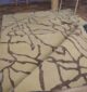 Luxurious handmade silk carpet displayed in a modern living room, available at the best carpet store in Dubai, offering premium rugs UAE.