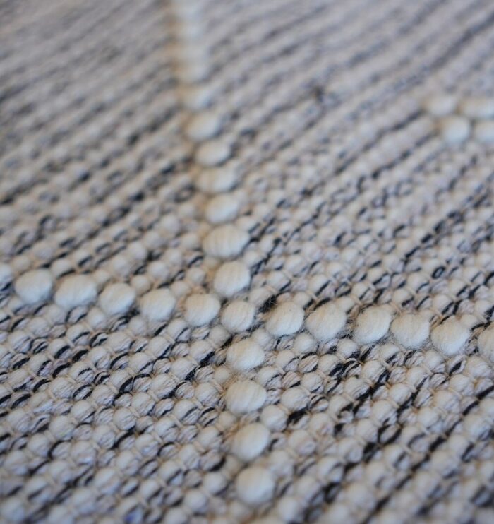 Hand woven wool rug from India, perfect as a bohemian hallway rug or indoor rug for modern homes in UAE and Dubai.