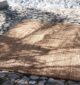 Handcrafted natural jute rug for living rooms, outdoor patios, and modern homes in UAE.