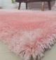 Soft shaggy rug with plush texture, modern design, and cozy comfort for home décor.
