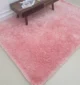 Soft shaggy rug with plush texture, modern design, and cozy comfort for home décor.