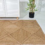 Handmade jute rug living room setting, showcasing artisanal craftsmanship and natural textures