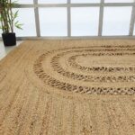 Handmade Living Room Circle Jute Rug - BR 085 showcasing its braided design in a cozy living room setup.