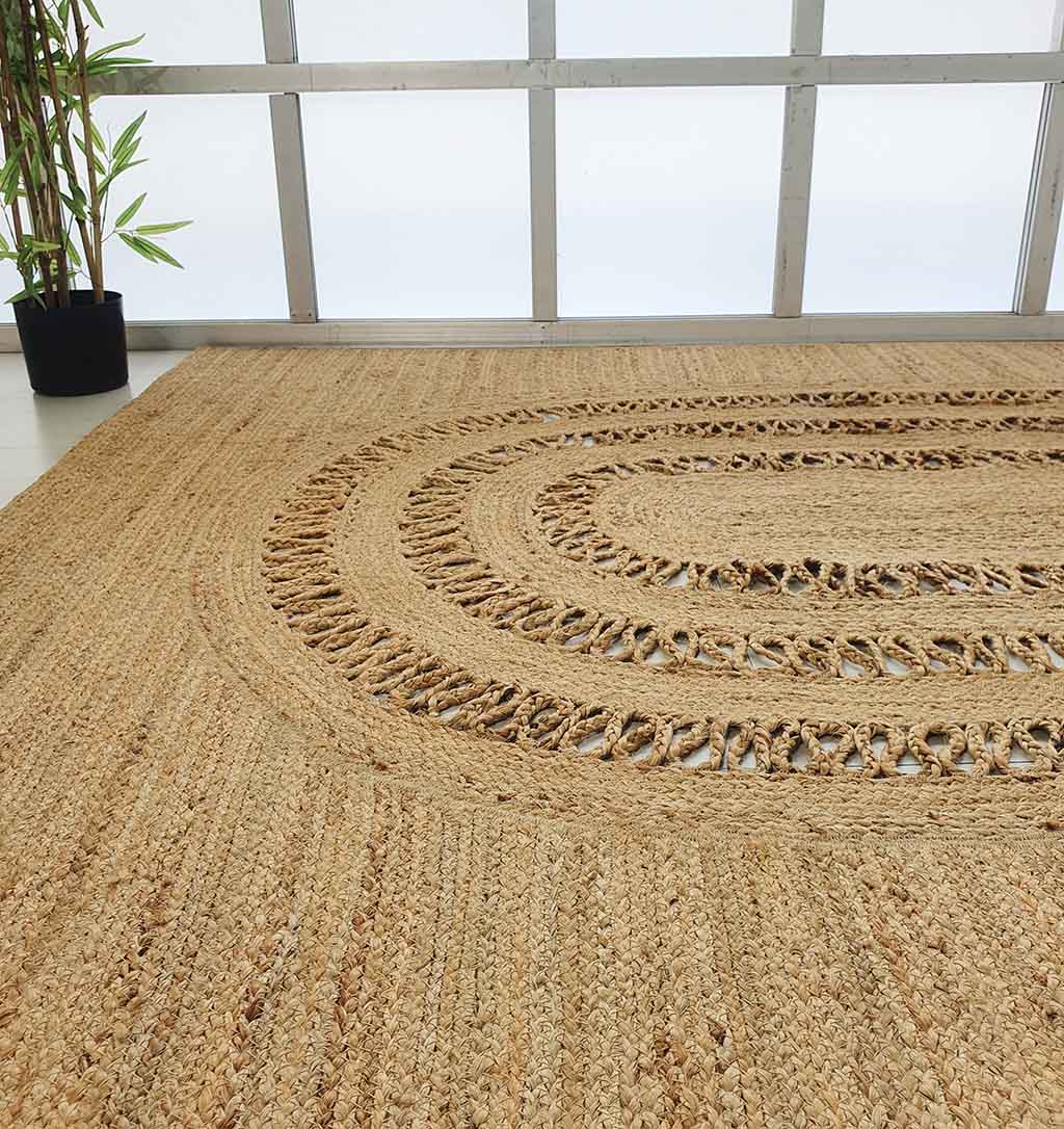 Handmade Living Room Circle Jute Rug - BR 085 Handmade Living Room Circle Jute Rug - BR 085 showcasing its braided design in a cozy living room setup.