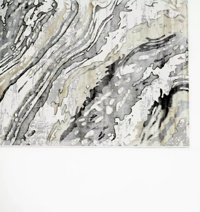 Durable machine-made rug with modern patterns, soft finish, and versatile design for home décor.