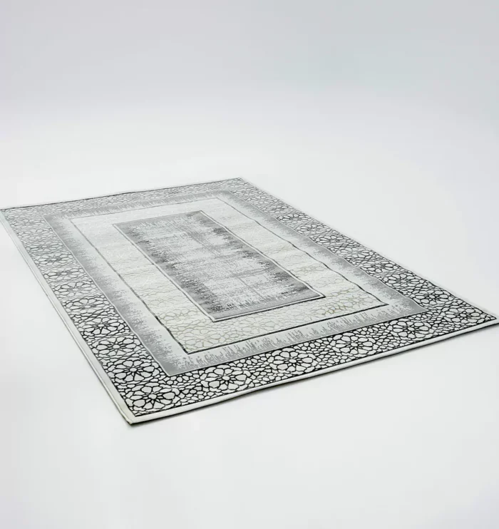 Durable machine-made rug with modern patterns, soft finish, and versatile design for home décor.