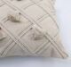 White decorative cushion with soft fabric and elegant design