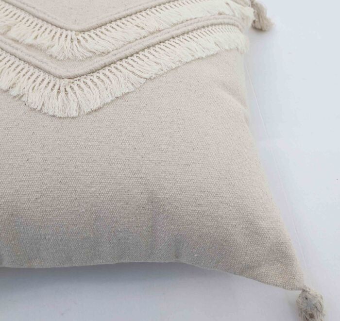 Handmade decorative tassel cushion in natural shade