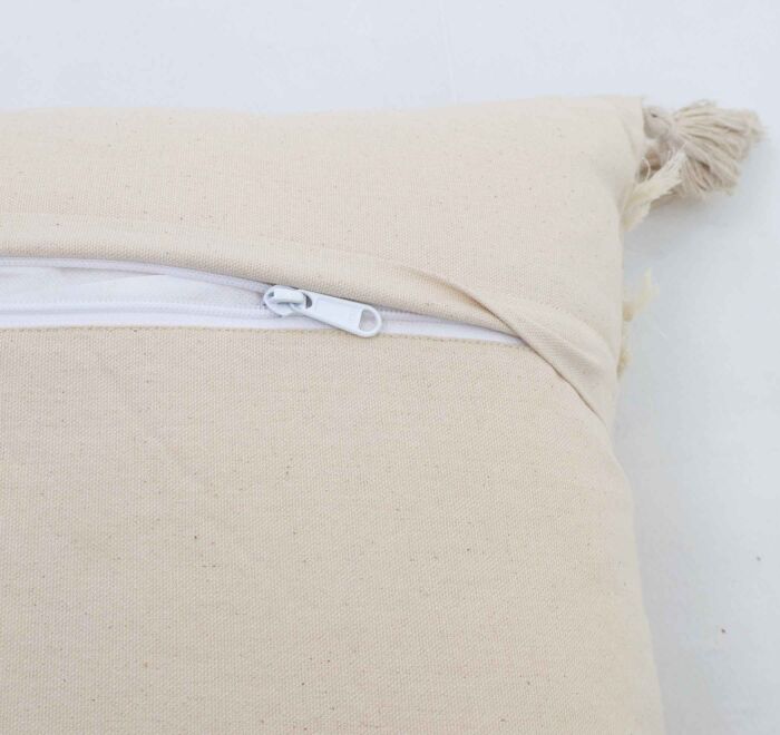 Handmade decorative tassel cushion in natural shade