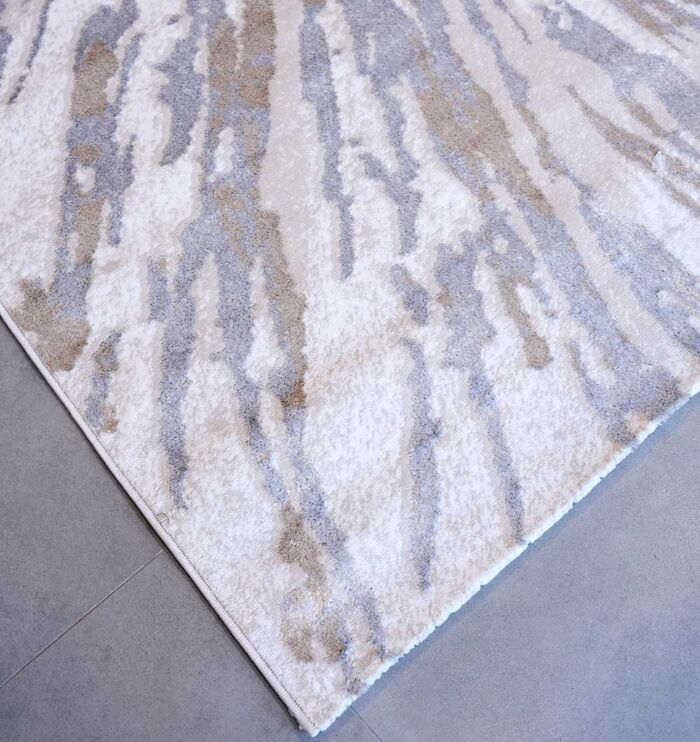 Machine-made rug with durable construction, stylish design, and easy-care comfort for modern homes.