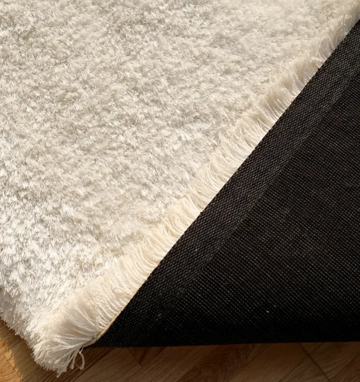 Soft shaggy rug with plush texture, modern design, and cozy comfort for home décor.