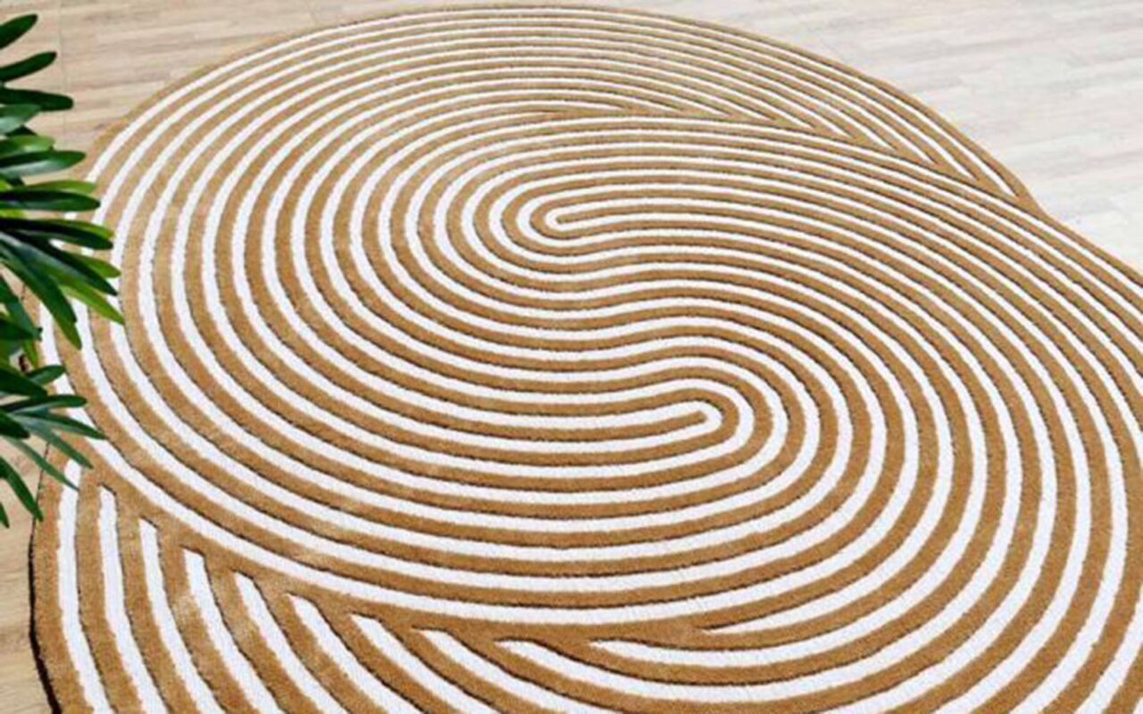 Artistic, unique shaped rugs with flowing curves and swirls, adding a modern touch to a stylish living room.