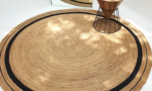 Round Jute Rug Under Desk – Natural and Stylish Workspace Decor Round jute rug placed under desk in modern home office interior