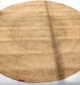 Handmade natural braided jute rug with eco-friendly design, rustic charm, and durable craftsmanship.