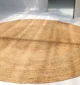 Handmade natural braided jute rug with eco-friendly design, rustic charm, and durable craftsmanship.