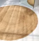 Handmade natural braided jute rug with eco-friendly design, rustic charm, and durable craftsmanship.