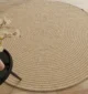 Handmade natural braided jute rug with eco-friendly design, rustic charm, and durable craftsmanship.