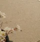 Handmade natural braided jute rug with eco-friendly design, rustic charm, and durable craftsmanship.