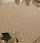 Handmade natural braided jute rug with eco-friendly design, rustic charm, and durable craftsmanship.