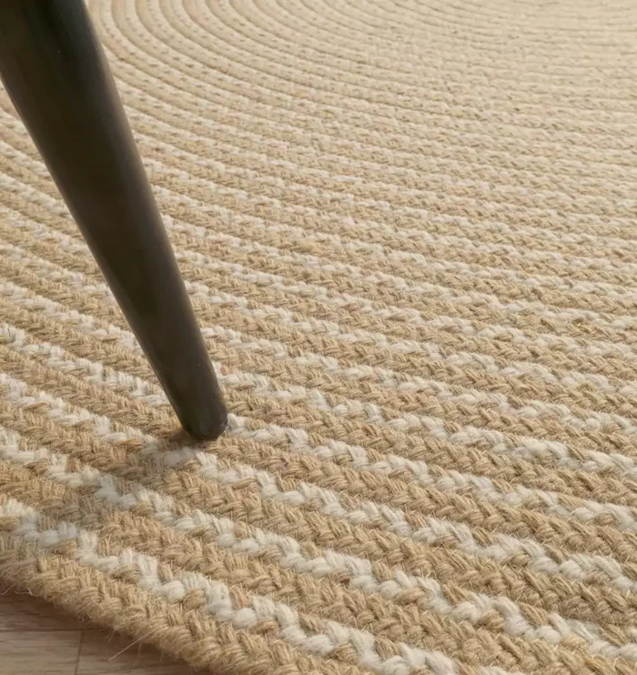 Rug Maintenance Myths Debunked Handmade natural braided jute rug with eco-friendly design, rustic charm, and durable craftsmanship.