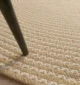 Rug Maintenance Myths Debunked Handmade natural braided jute rug with eco-friendly design, rustic charm, and durable craftsmanship.