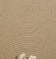 Handmade natural braided jute rug with eco-friendly design, rustic charm, and durable craftsmanship.
