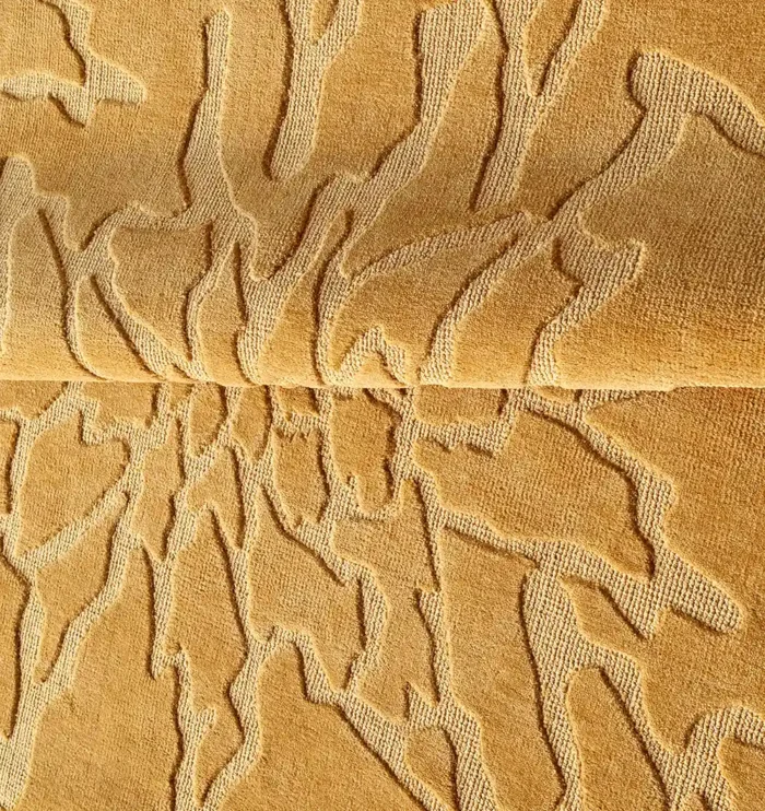 Handmade wool rug with intricate design, soft texture, and timeless decorative appeal for home interiors.