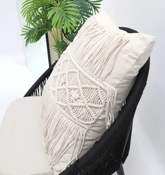 Natural white macrame cushion with handcrafted detailing, soft texture, and stylish home décor appeal.