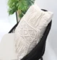 Natural white macrame cushion with handcrafted detailing, soft texture, and stylish home décor appeal.