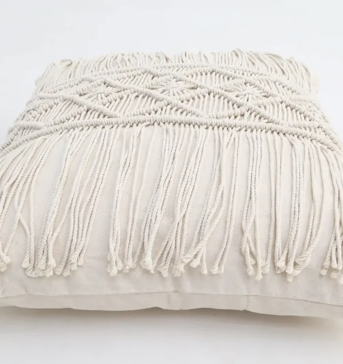 Natural white macrame cushion with handcrafted detailing, soft texture, and stylish home décor appeal.