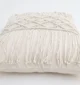 Natural white macrame cushion with handcrafted detailing, soft texture, and stylish home décor appeal.