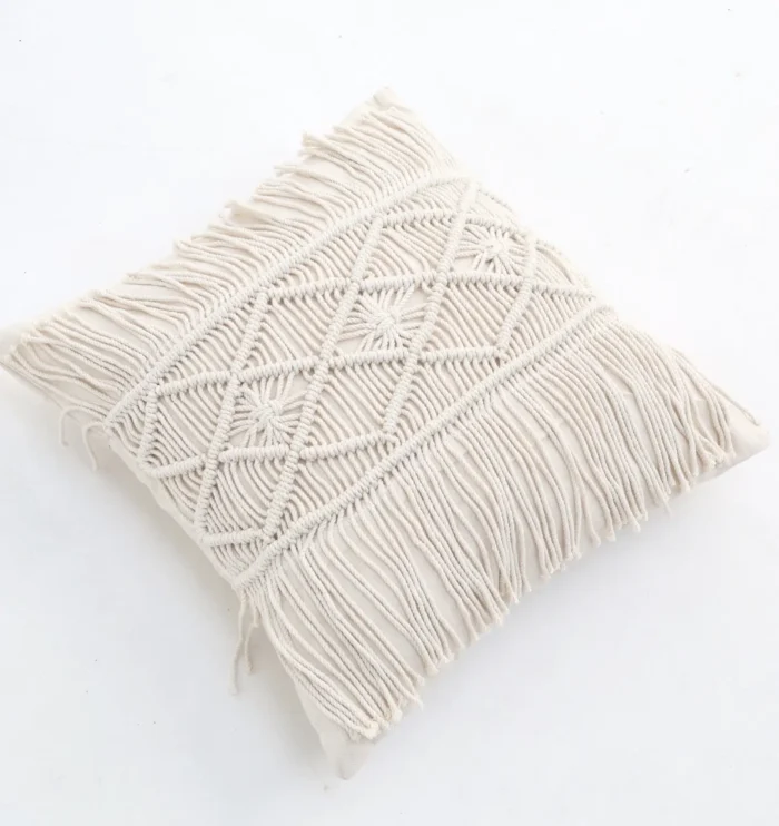 Natural white macrame cushion with handcrafted detailing, soft texture, and stylish home décor appeal.
