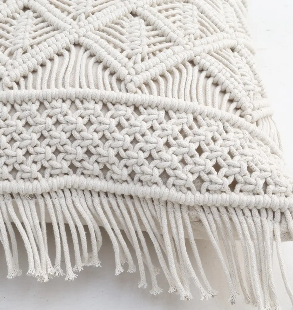 CS-308 (4) Natural white macrame cushion with handcrafted detailing, soft texture, and stylish home décor appeal.