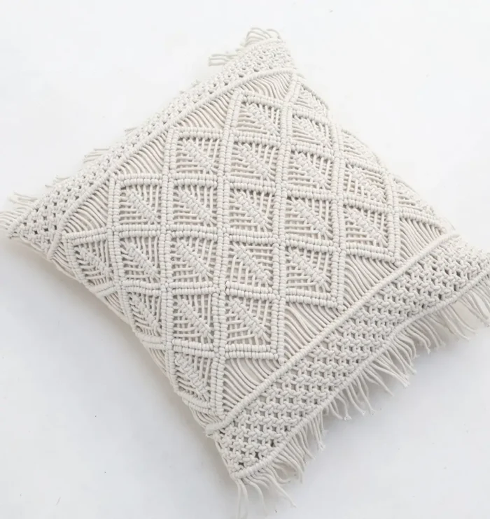 Natural white macrame cushion with handcrafted detailing, soft texture, and stylish home décor appeal.