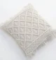 Natural white macrame cushion with handcrafted detailing, soft texture, and stylish home décor appeal.