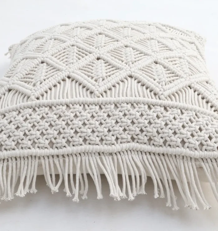 Natural white macrame cushion with handcrafted detailing, soft texture, and stylish home décor appeal.