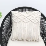 Natural white macrame cushion with handcrafted detailing, soft texture, and stylish home décor appeal.