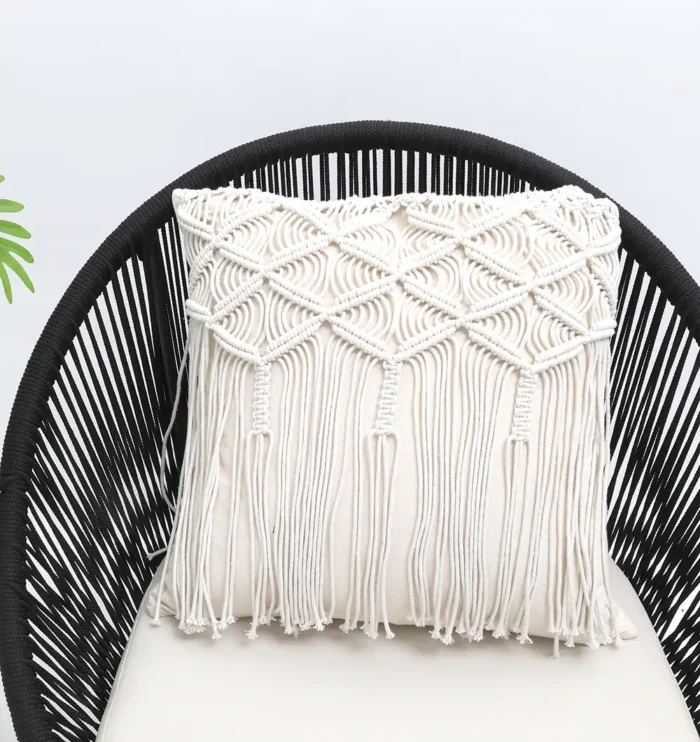 Natural white macrame cushion with handcrafted detailing, soft texture, and stylish home décor appeal.