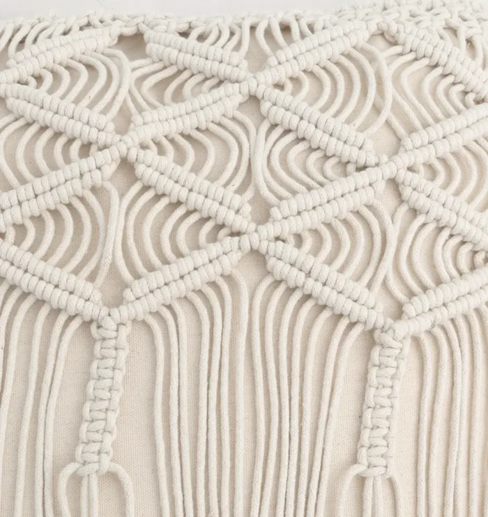 Natural white macrame cushion with handcrafted detailing, soft texture, and stylish home décor appeal.