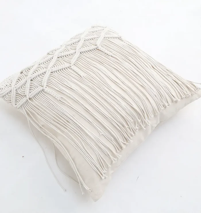 Natural white macrame cushion with handcrafted detailing, soft texture, and stylish home décor appeal.