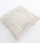 Natural white macrame cushion with handcrafted detailing, soft texture, and stylish home décor appeal.