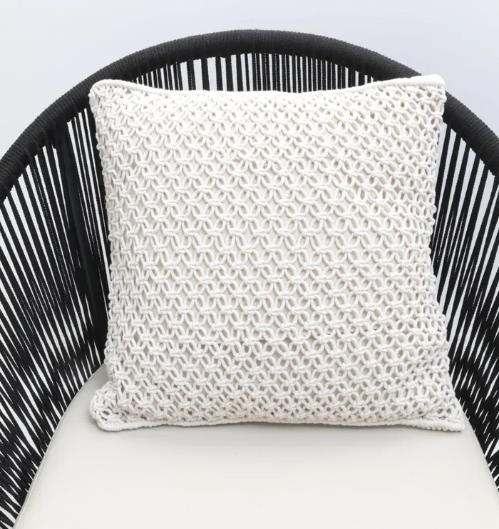 Natural white macrame cushion with handcrafted detailing, soft texture, and stylish home décor appeal.