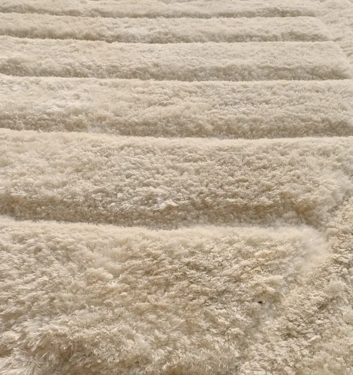 Soft shaggy rug with plush texture, modern design, and cozy comfort for home décor.
