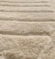 Soft shaggy rug with plush texture, modern design, and cozy comfort for home décor.