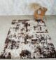 Machine-made rug with durable construction, stylish design, and easy-care comfort for modern homes.